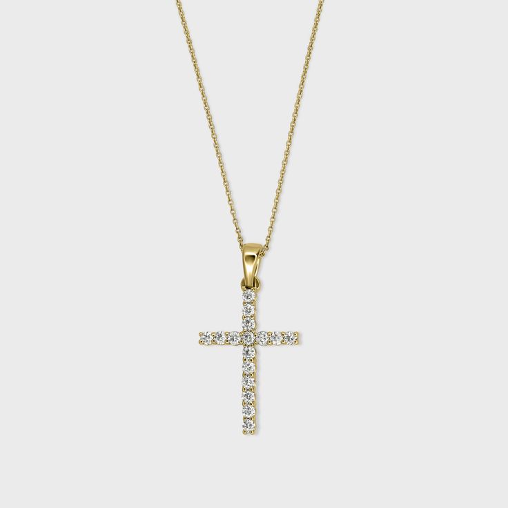 A solid gold Cross adorned with natural diamonds. Gold Pendant Cross Necklace With Diamond Cut, Brilliant Cut Diamond Cross Pendant Jewelry, 14k Gold Cross Pendant With Diamond Cut, Yellow Gold Diamond Cut Cross Pendant, Diamond Circle Pendant, 14k Gold Diamond-cut Cross Pendant, Circle Diamond, Diamond Cross, Diamond Cross Pendants