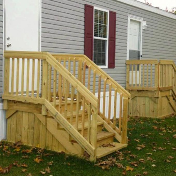 two wooden steps leading up to a house