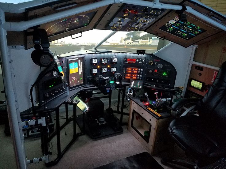 the inside of an airplane cockpit with many electronic devices