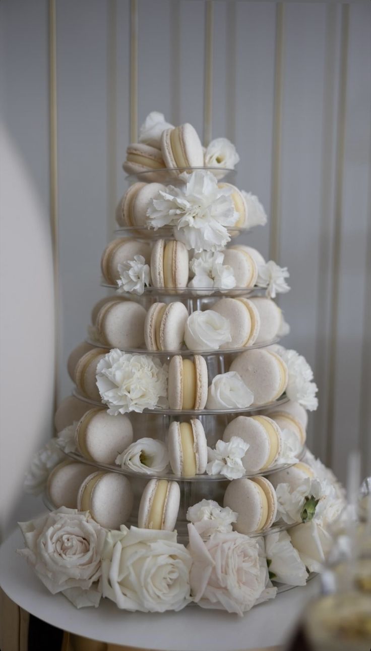 a wedding cake made out of macaroons and flowers