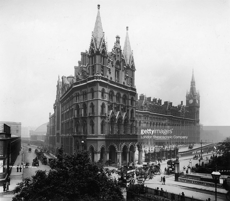 an old black and white photo of a large building with many spires on it