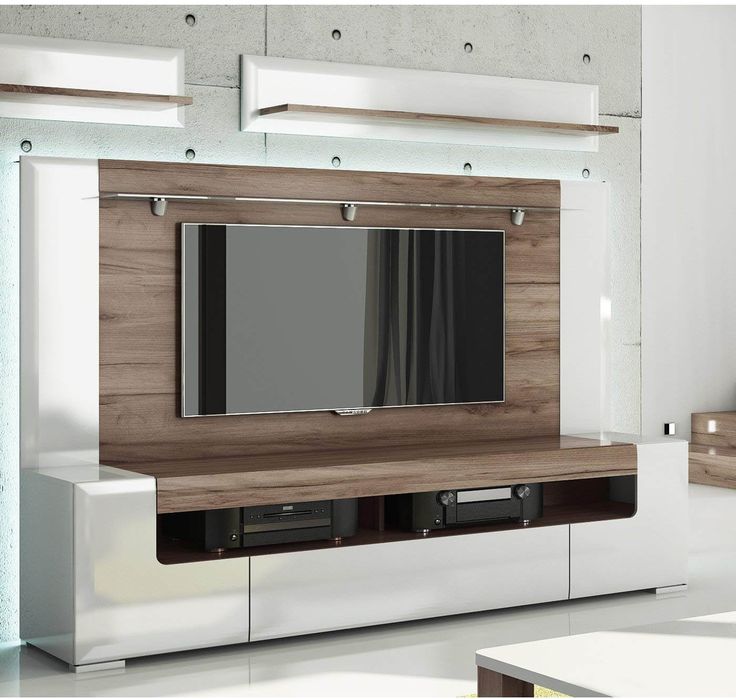 an entertainment center with a flat screen tv mounted to it's side