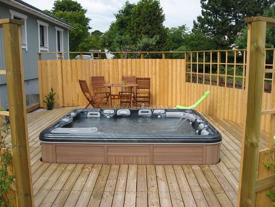 Look how amazing this sunken in hot tub is! backyard deck 