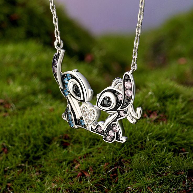 Have you heard of the love story between the monsters? This little monster necklace is a scene of them being close to each other, heart to heart. Made of sterling silver, the heart necklace is beautifully designed and features a pair of iconic monster couples. A love heart holds them together in the middle. This necklace seems to carry a magical and warm love story. No matter how rough the adventure road is, the two monsters will hold each other tightly and protect their love. May this love necklace witness your love story and be full of joy and warmth forever.Carat Weight: 0.349 ctStone Size: 1.2,1.5,1.5,1.5,1.2 mmStone Type: Jeulia® StoneNumber of Stones: 23 Stone Color: Diamond White, Fancy Pink, Amethyst Purple, Fancy Black, Aquamarine BlueStone Shape: RoundWeight: 2.9 gWidth: 9.1 mmHe Pendant Clavicle Chain Jewelry For Friendship, Clavicle Pendant Chain Jewelry For Friendship, Silver Clavicle Chain Necklace For Friendship, Sterling Silver Pendant Necklaces For Friendship, Whimsical Silver Necklace For Valentine's Day, Valentine's Day Silver Charm Necklaces, Valentine's Day Silver Necklaces With Charms, Sterling Silver Necklace For Friendship, Valentine's Day Silver Necklace