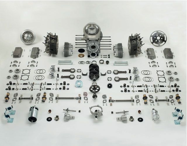 an assortment of various parts are displayed on a white surface