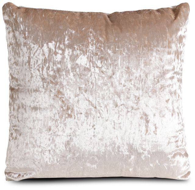 a beige velvet pillow on a white background