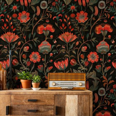 the wallpaper is very colorful and has red flowers on it, with green leaves