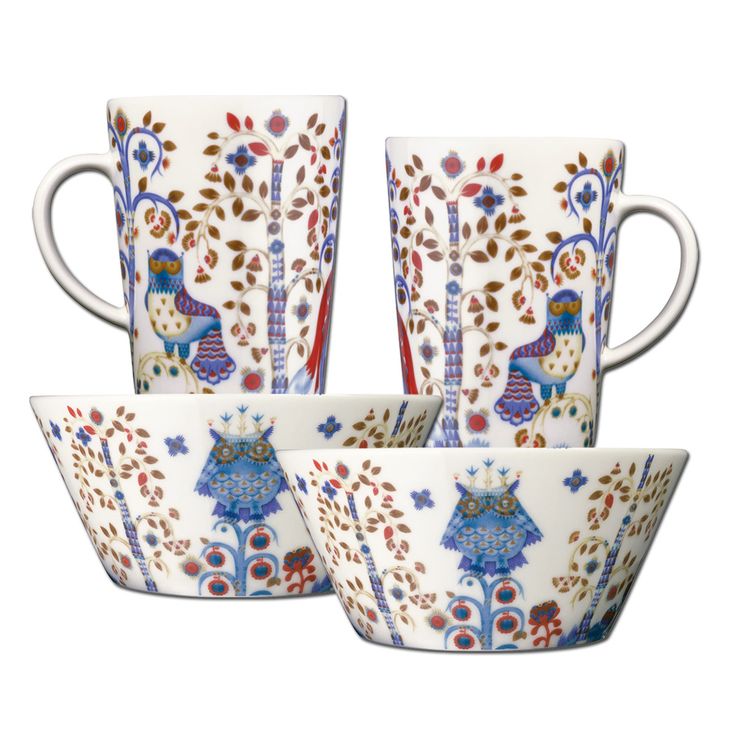 four coffee cups and saucers decorated with peacocks, leaves and flowers on white background