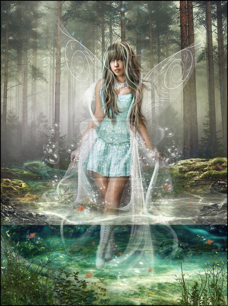 a beautiful young woman standing in the woods with her wings spread over her head and body