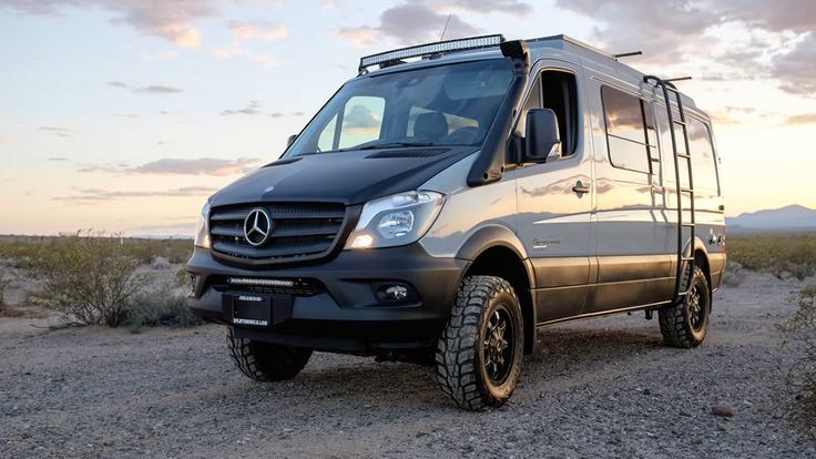 a mercedes van is parked in the desert