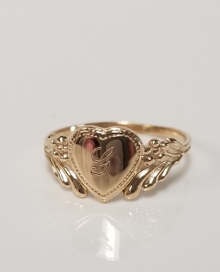 "Thanks for shopping our vintage estate store. We tend to sell well below wholesale and truly hope you enjoy all of our items. Many of the items are one of a kind, so please enjoy scrolling through the pictures and hopefully something will catch your eye. Brown spots are from camera or reflections. Estate 10k yellow gold monogram capital G cursive heart ring. Custom made ring for our shop. Ring size: 3 Setting: 7.5mm 1/4\" to 3/8\" Band width: 1.4mm Weight: .90 gram Marked 10k and it's sweet. On G Initial Ring, 14k Gold Engraved Ring With Initials For Collectors, Personalized Engraved Yellow Gold Ring For Collectors, Vintage Ring Stamped 14k For Anniversary, Vintage Ring For Anniversary, Stamped 14k, Personalized Yellow Gold Signet Ring Collectible, Heirloom Jewelry For Valentine's Day, 14k Yellow Gold Engraved Ring For Valentine's Day, Heirloom Engraved Jewelry For Valentine's Day