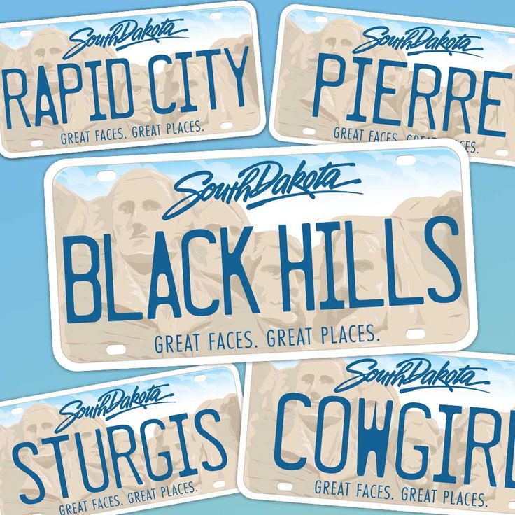 four license plates with the words black hills on them