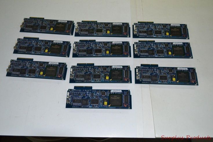 eight pieces of printed circuit board laid out on a table