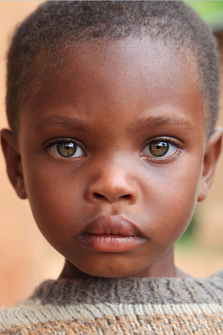 an image of a little boy looking at the camera