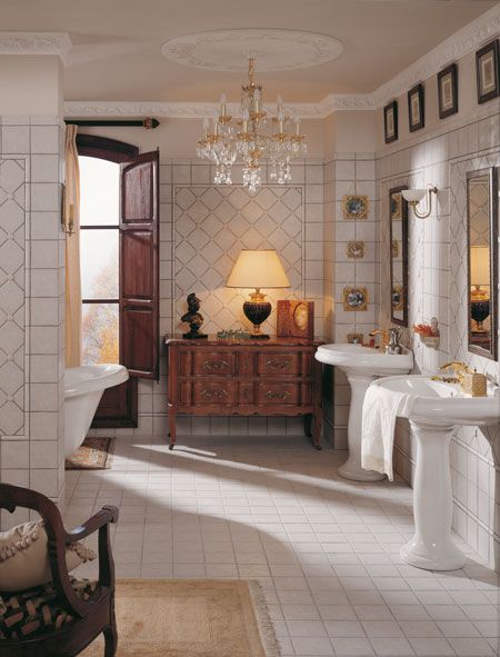 a large bathroom with two sinks and a tub