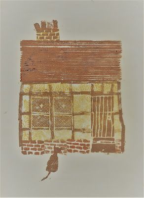 a drawing of a house with a cat on the roof