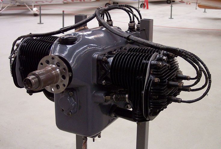 an airplane engine sitting on top of a metal stand