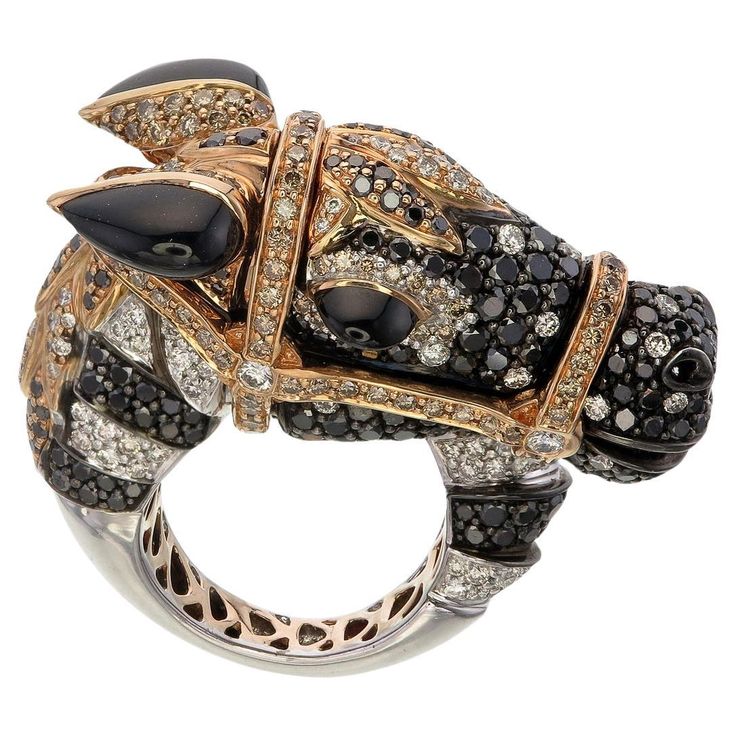 In the world of jewelry, there are pieces that transcend craftsmanship and become timeless works of art. The Arabian Elegance Ring is one such masterpiece, a dazzling tribute to the grace and majesty of the Arabian horse, crafted with the rarest of gemstones. This exceptional ring is a symphony of elegance, combining the striking contrast of black, white, and yellow diamonds to create a mesmerizing visual spectacle. Each detail of this masterpiece has been meticulously designed to capture the sp Luxury Diamond Ring With Polished Finish, Evening Diamond Ring Jewelry, Luxury Gemstone Jewelry For Evening, Luxury Evening Ring Jewelry, Luxury Collectible Rings With Brilliant Cut, Luxury Black Diamond Ring, Luxury Brilliant Cut Jewelry For Evening, Luxury Evening Ring, Designer Jewelry With Intricate Design For Formal Occasions