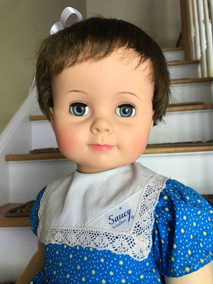 an old doll is sitting on the stairs