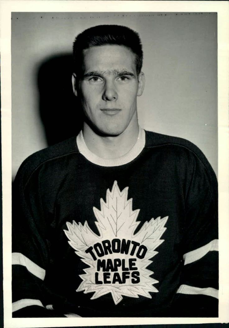 an old black and white photo of a man wearing a toronto maple leafs hockey jersey