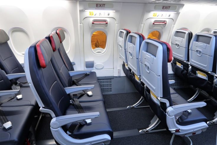 rows of empty seats in an airplane