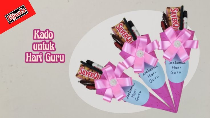 candy wrapped in pink ribbon with name tag on it and the words kado untuk hari guruu