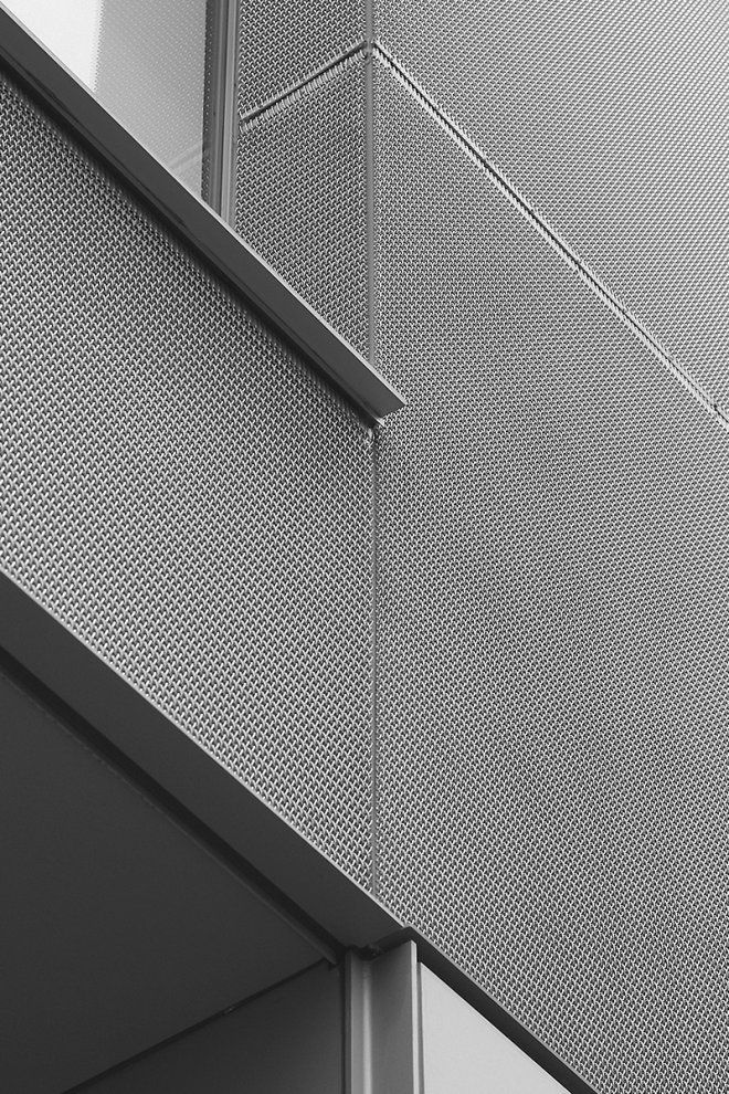 a black and white photo of the side of a building