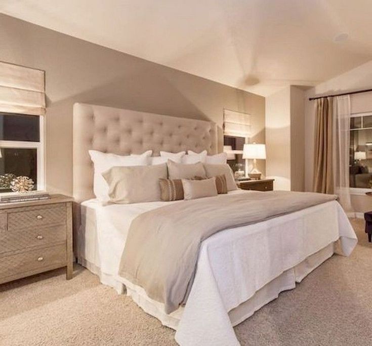 a bedroom with a large bed and two nightstands