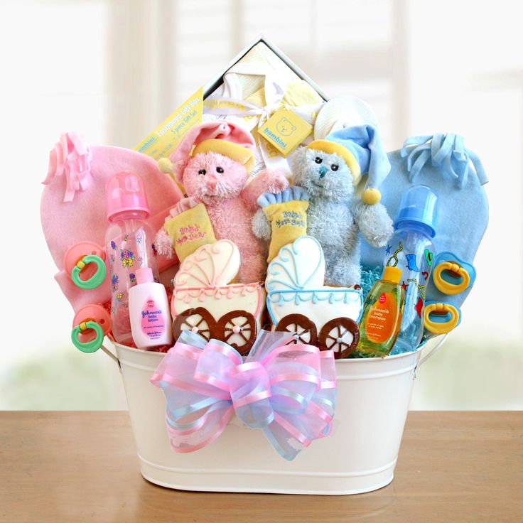 a white basket filled with baby items on top of a table