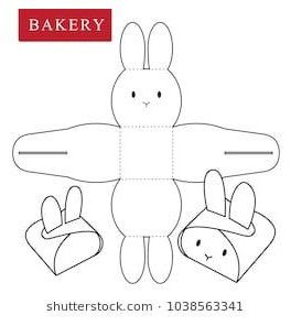 an image of a paper doll with two bunnies on the front and one in the back