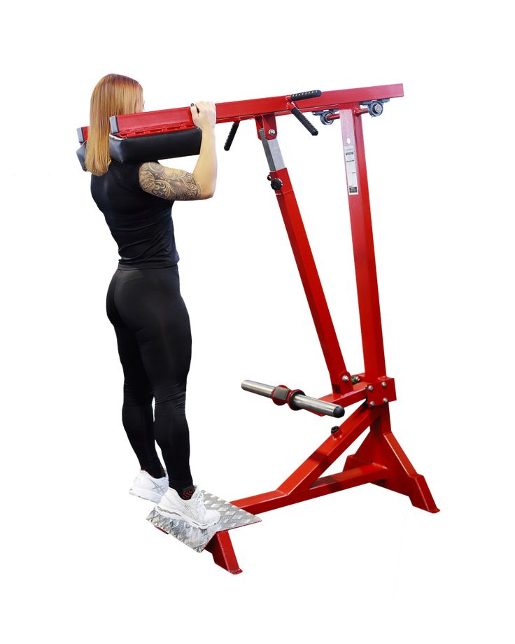 a woman is doing an exercise on a red stand with one arm extended and the other leg bent