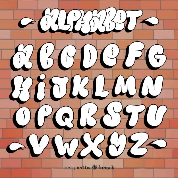 the alphabet in graffiti style on a brick wall