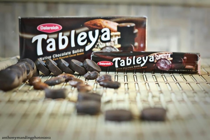 table with chocolate bar and nuts on it next to an empty tube of tableya