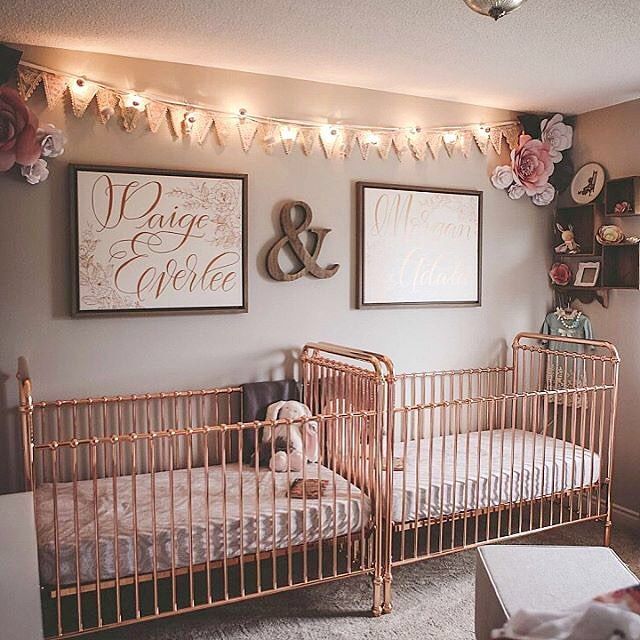 two baby cribs are decorated with pink and gold decor