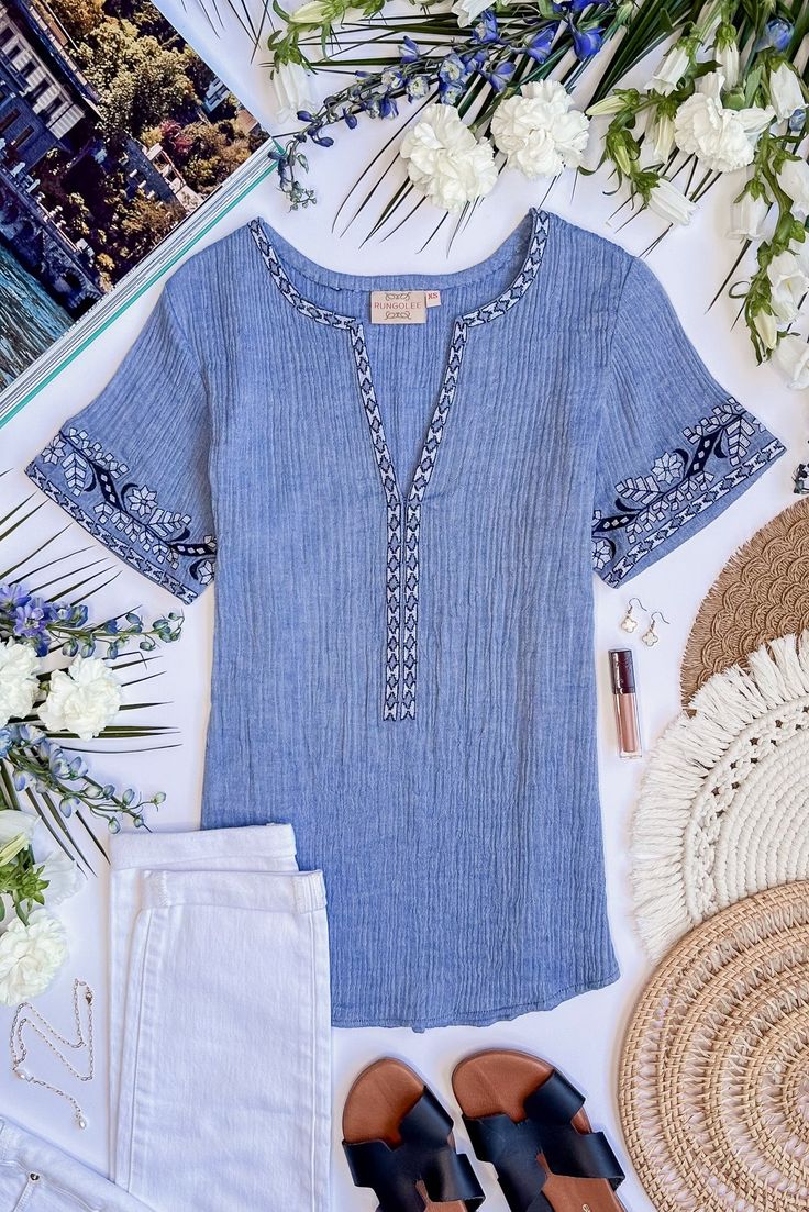 Inspired by the gorgeous mediterranean island of Sicily, this blouse is the epitome of vacation-chic. We love the soft cotton crinkle gauze of this easy breezy style, detailed with the prettiest embroidery at the v neck and sleeves. Pair with a straw bag and sandals. Vacation Chic, Cape Blouse, Breezy Style, Travel Chic, Pretty Embroidery, Blouse Embroidery, Pink Box, Blouse Short Sleeve, Easy Breezy