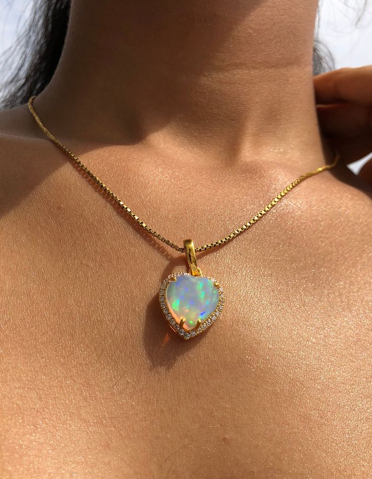 Product Details : ✦ Stone Name: Ethiopian Opal ✦ Metal : Gold plating on Genuine 925 Solid Sterling Silver This is a beautiful heart shape jewelry set which consist of Earrings, pedant and ring. It is made with lots of love and warmth! For more pieces like these visit https://www.etsy.com/in-en/shop/kanchanglobal?ref=seller-platform-mcnav&section_id=27149585 Your satisfaction is our priority ! ---------------------------- A great gift idea for: Birthdays Valentines Day Gift Anniversary Gift Valentine's Day Silver Opal Jewelry, Tarnish Resistant Gold Opal Jewelry, Fine Jewelry Gold Plated Heart Cut, Gold Plated Heart Cut Fine Jewelry, Heart-shaped Cubic Zirconia Tarnish-resistant Jewelry, Heart-shaped Tarnish Resistant Cubic Zirconia Jewelry, Gold Pendant Heart Necklace With Gemstone, Fine Jewelry Opal In Gold, Fine Jewelry Gold Heart Cut