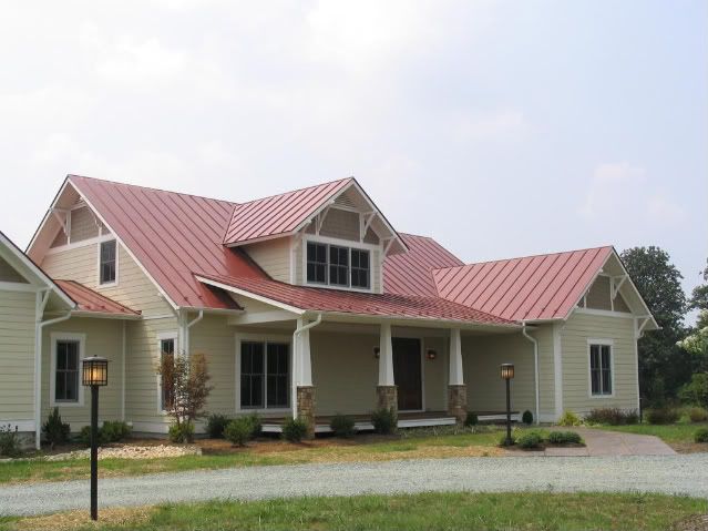 a house with a red roof is shown on the phone screen, and there is also an image of it