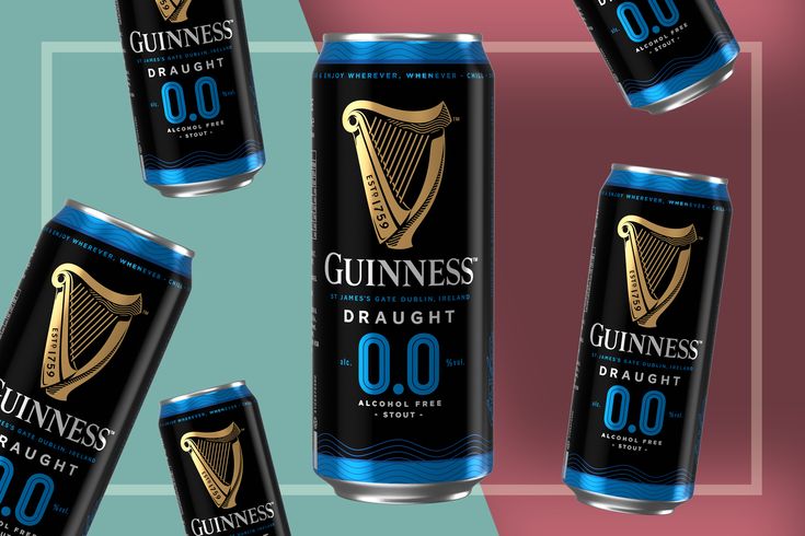 four cans of guinness draught on a multicolored background with the same beer in each can