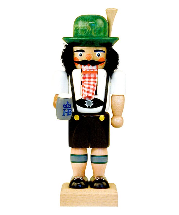 a wooden nutcracker with a green hat and tie