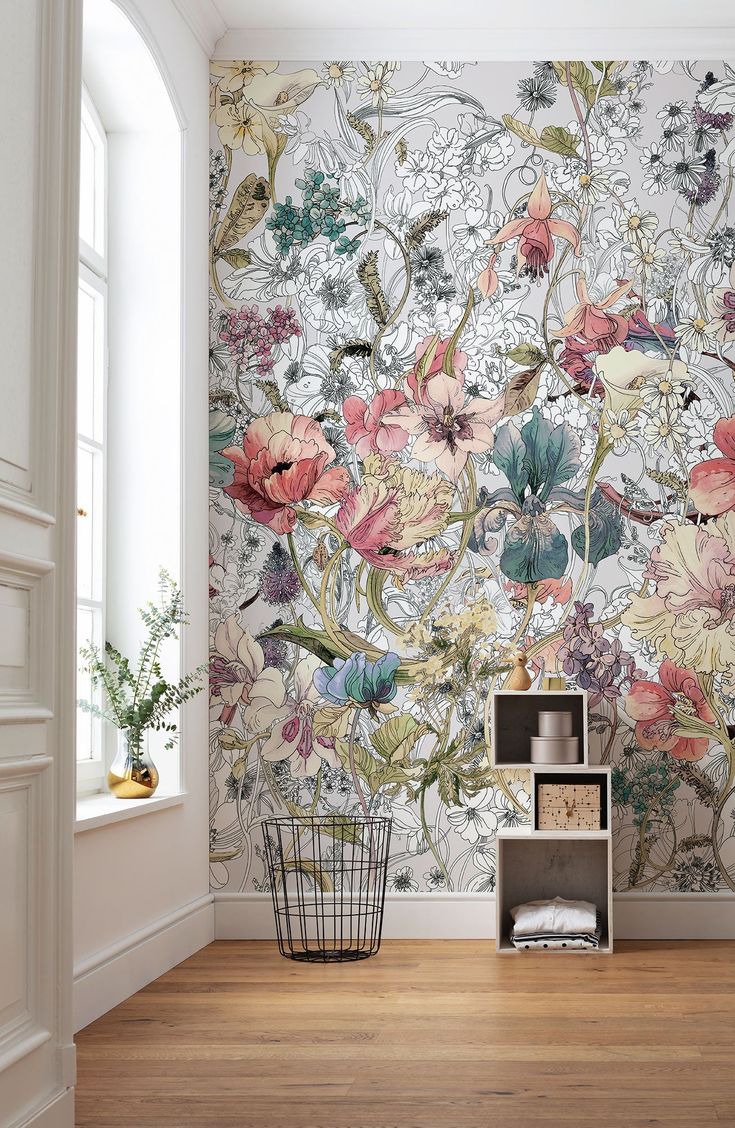 the wallpaper in this room is painted with flowers