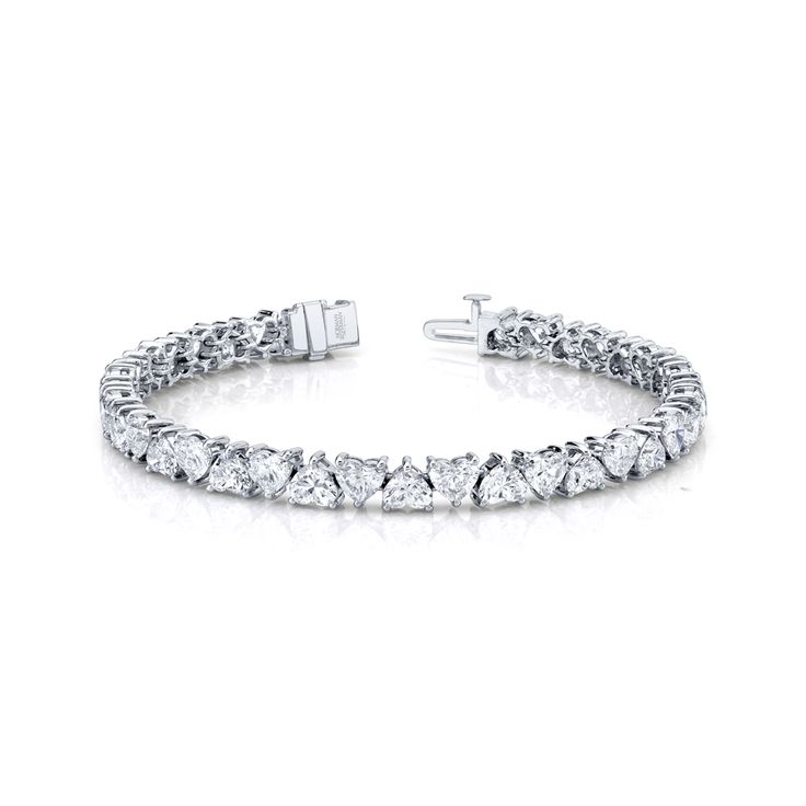 Heart shape diamond bracelet set in 18K white gold. 15.86 Total Carat Weight 38 Total Stones Heart Shaped Diamond Bracelet, Luxury Heart Cut Diamond Bracelet With Diamond Accents, Platinum Diamond Cut Bracelet In Diamond White, White Platinum Diamond Bracelet, White Platinum Diamond Bracelet Fine Jewelry, Heart Cut Diamond Tennis Bracelet For Anniversary, Classic White Gold Diamond Heart Bracelet, Diamond Heart Cut Tennis Bracelet For Anniversary, White Gold Heart Cut Tennis Bracelet For Anniversary