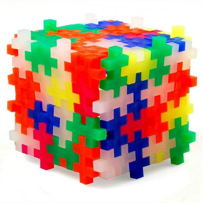 a multicolored puzzle piece sitting on top of each other