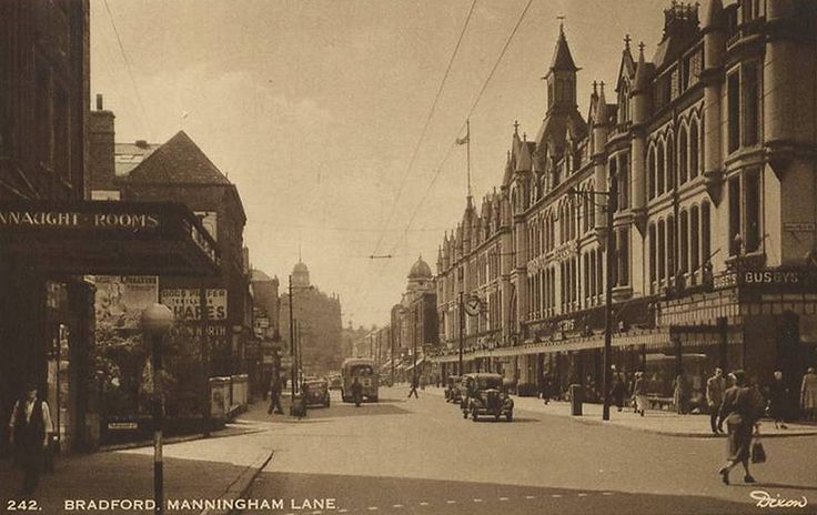 an old black and white photo of a street