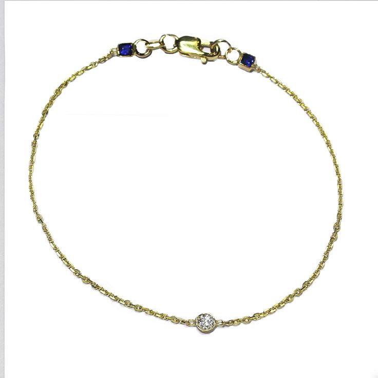 I've been adding a personal touch to the clasps of my pieces and I recently designed this bracelet for a client... Composed of a .07 carat solitaire diamond, GSI or above and two .07 carat sapphires, set in 14k gold bezels and cable chain with lobster clasp closure. I love adding an unexpected element while maintaining the simplicity of a piece and you will be seeing more of this in my designs to come! Available in 14k white, yellow and rose gold. Size 6 - 7 inches or specify a custom size in yo 14k Yellow Gold Diamond Bracelet With Single Diamond, Classic 14k Gold Diamond Bracelet With Vvs Clarity, Everyday Luxury Single Diamond Jewelry, Fine Jewelry Diamond Gold Bracelet For Anniversary, Brilliant Cut Diamond Chain Bracelet For Anniversary, 14k Gold Round Diamond Bracelet Fine Jewelry, Formal Fine Jewelry Gold Bracelet With Bezel Setting, 14k Gold Diamond Bracelet With Diamond Accents, Luxury Single Diamond Tennis Bracelet For Formal Occasions