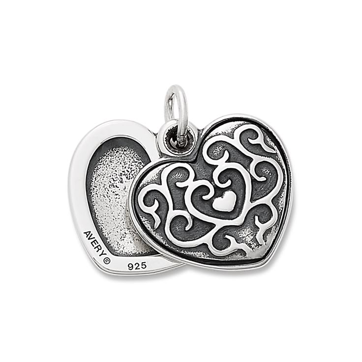 Tuck a treasured photo in this sterling silver locket accented with graceful scrolling details. The front gently swivels open to reveal what you carry inside the heart. Engrave the back of the locket with special messages, dates, names or initials. Engraved Open Heart Locket Necklace, Engraved Sterling Silver Locket Necklace, Silver Double Heart Locket Necklace, Silver Locket Necklace With Charms For Anniversary, Silver Heart Charm Locket Necklace For Memorial, Silver Engraved Open Heart Locket Necklace, Sterling Silver Double Heart Locket Necklace For Anniversary, Engraved Sterling Silver Locket Necklace For Mother's Day, Silver Sterling Silver Locket Necklace With Charms