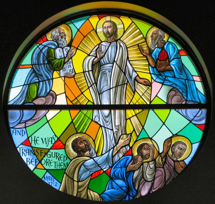 a stained glass window depicting the birth of jesus