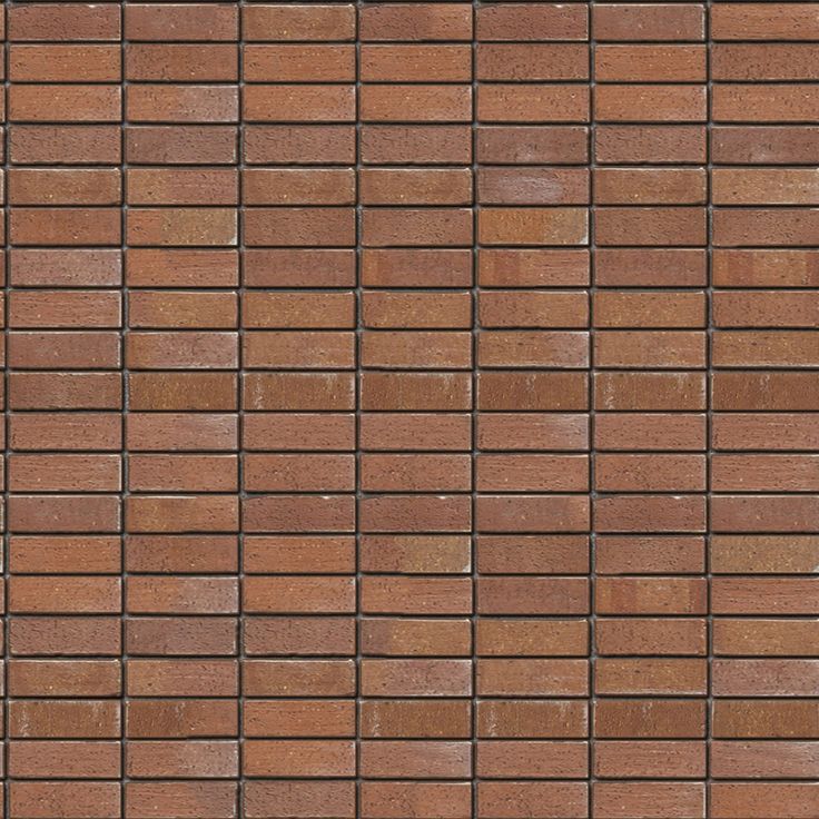 a brown brick wall that is very close up