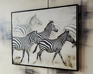 a group of zebras running together in the wild on a white and black background