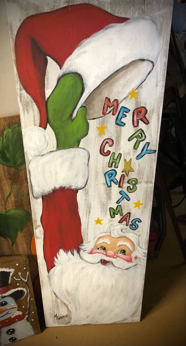 a painting of a santa clause with the words merry christmas written on it's side