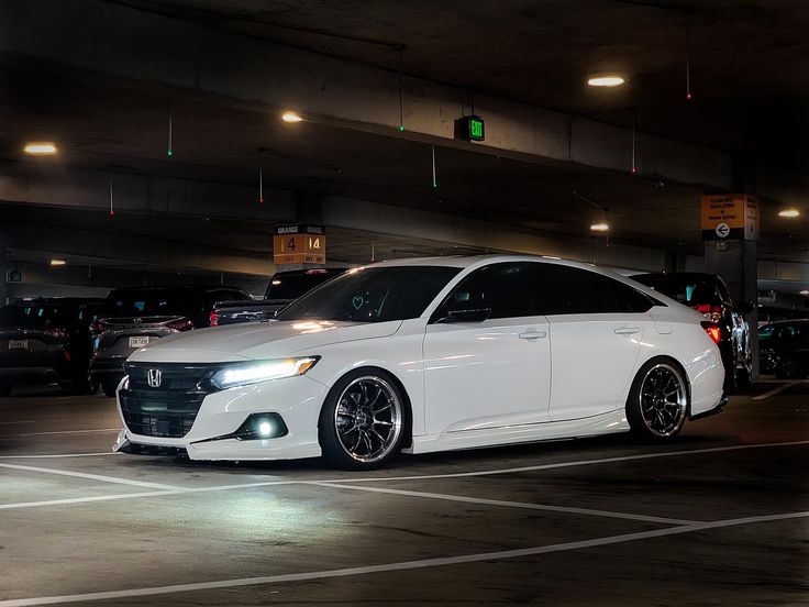 a white car parked in a parking garage